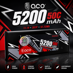 A QCG 5200 50C mAh portable power bank shown in its retail packaging box, with a black, red, and white geometric design. The image includes promotional text and feature icons at the bottom.